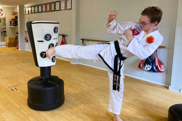 martial arts asheville instruction. Teen practicing taekwondo